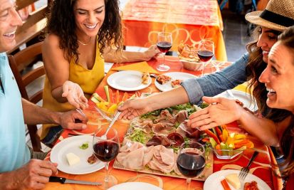 a group of millennials eating at a restaurant