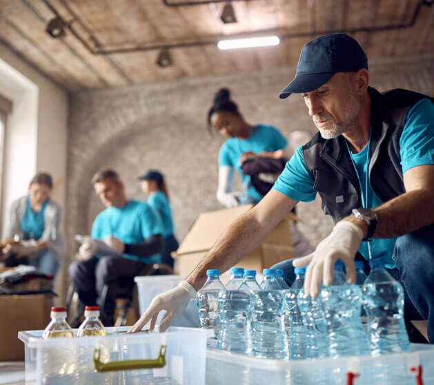 A group of volunteers packing emergency supplies for a non-profit