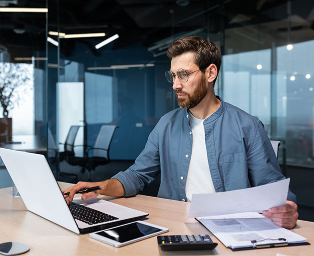 An dating app employee reviewing financial reports built form North's merchant portal