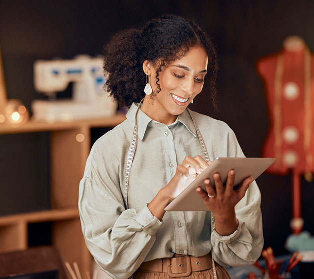 A seamstress reviewing her business's data using North merchant services