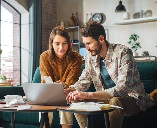 Family business owners looking over tax information using North POS systems