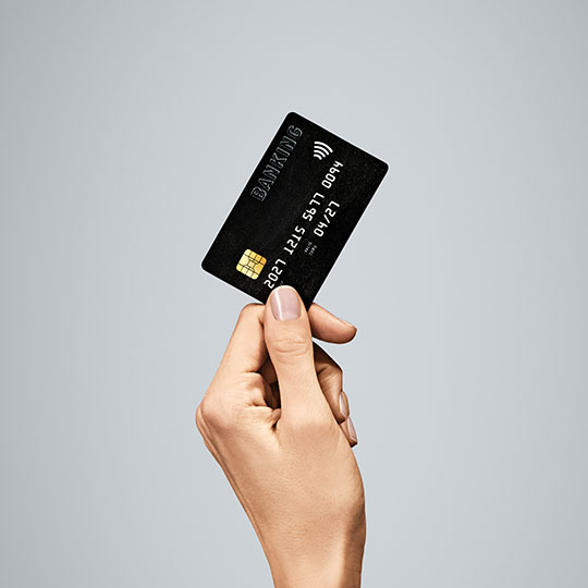 A hand holding a credit card representing enterprise big business 