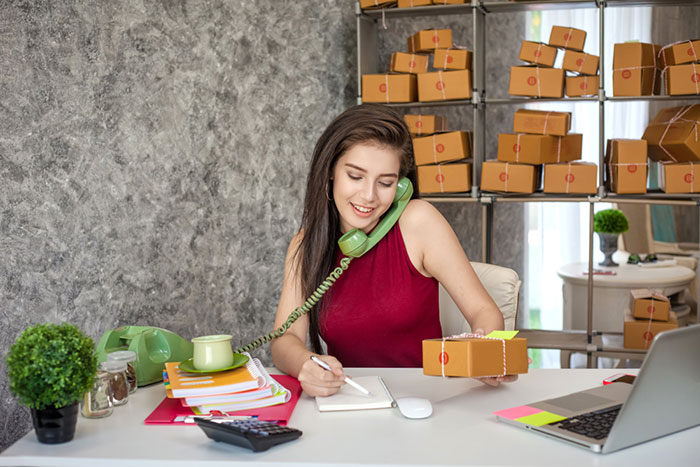 woman organizing online orders from her ecommerce store.